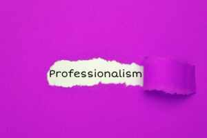 The word "Professionalism" is revealed through a torn hole in a bright purple paper background.